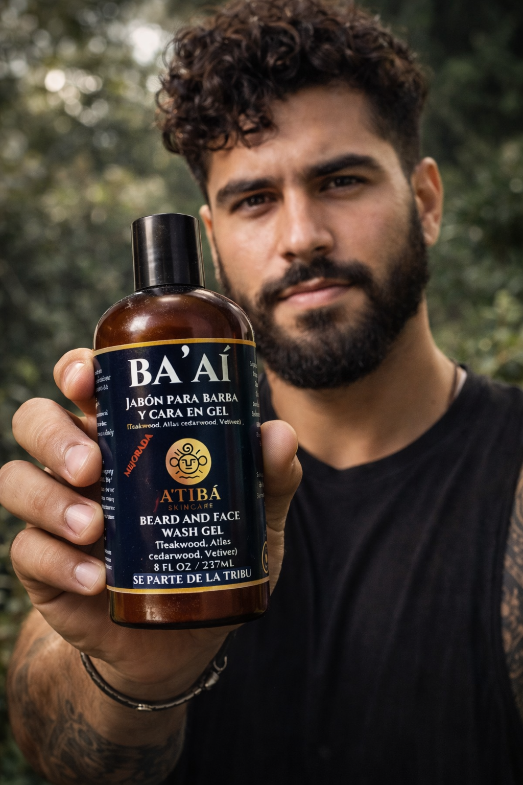Man holding a bottle of BA'AI beard and face wash gel with a natural background
