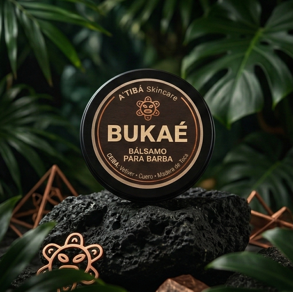 Bukaé beard balm tin on black volcanic rock with lush tropical leaves background.