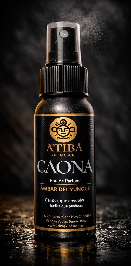 Noir: “CAONA Ámbar del Yunque EDP — luxury black-and-gold fragrance bottle — A’TIBÁ Skincare.