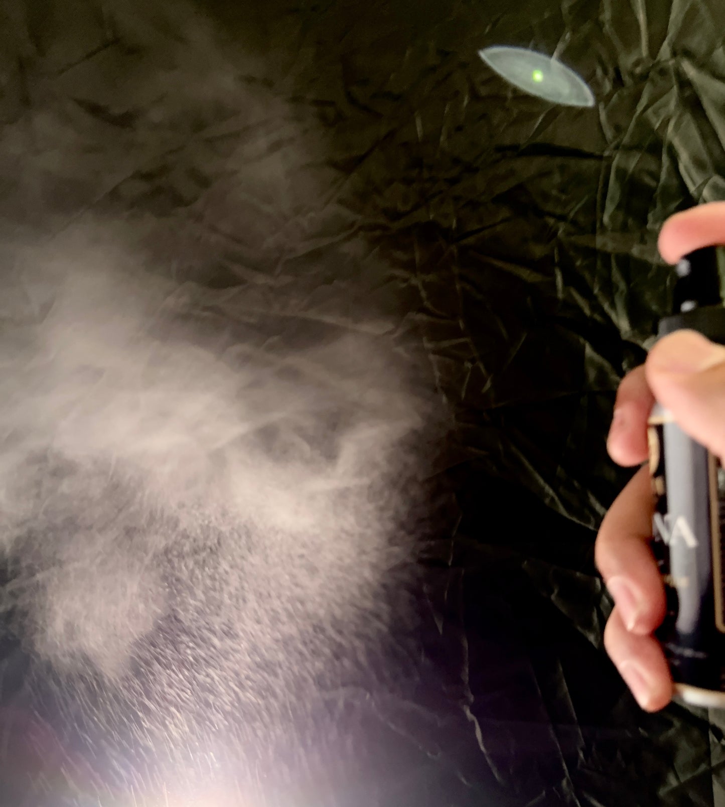 CAONA EDP fine mist spray action — shows spray pattern and mist.